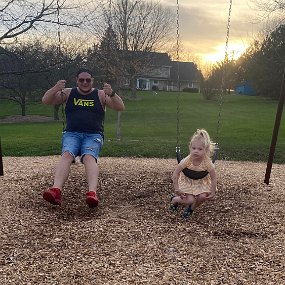 April 23 - 2 On the swings with Daddy