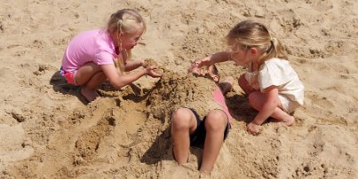 20230708_150306 Joshua's 40th birthday party - Lennon burying her cousin in the sand