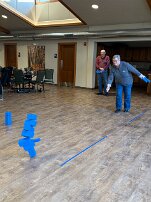 Jan - Kubb - Feb 11 - stack of 7 Playing Kubb - Jan knocked over that tower of 7 Kubbs!! We beat Don and Glenn.